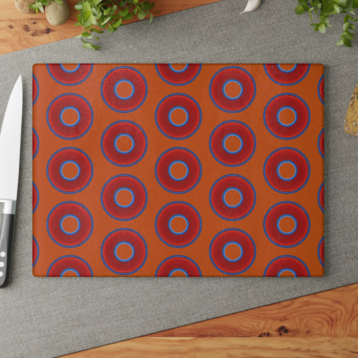 My Friend's Cutting Board - vivid red donuts w/dark orange background