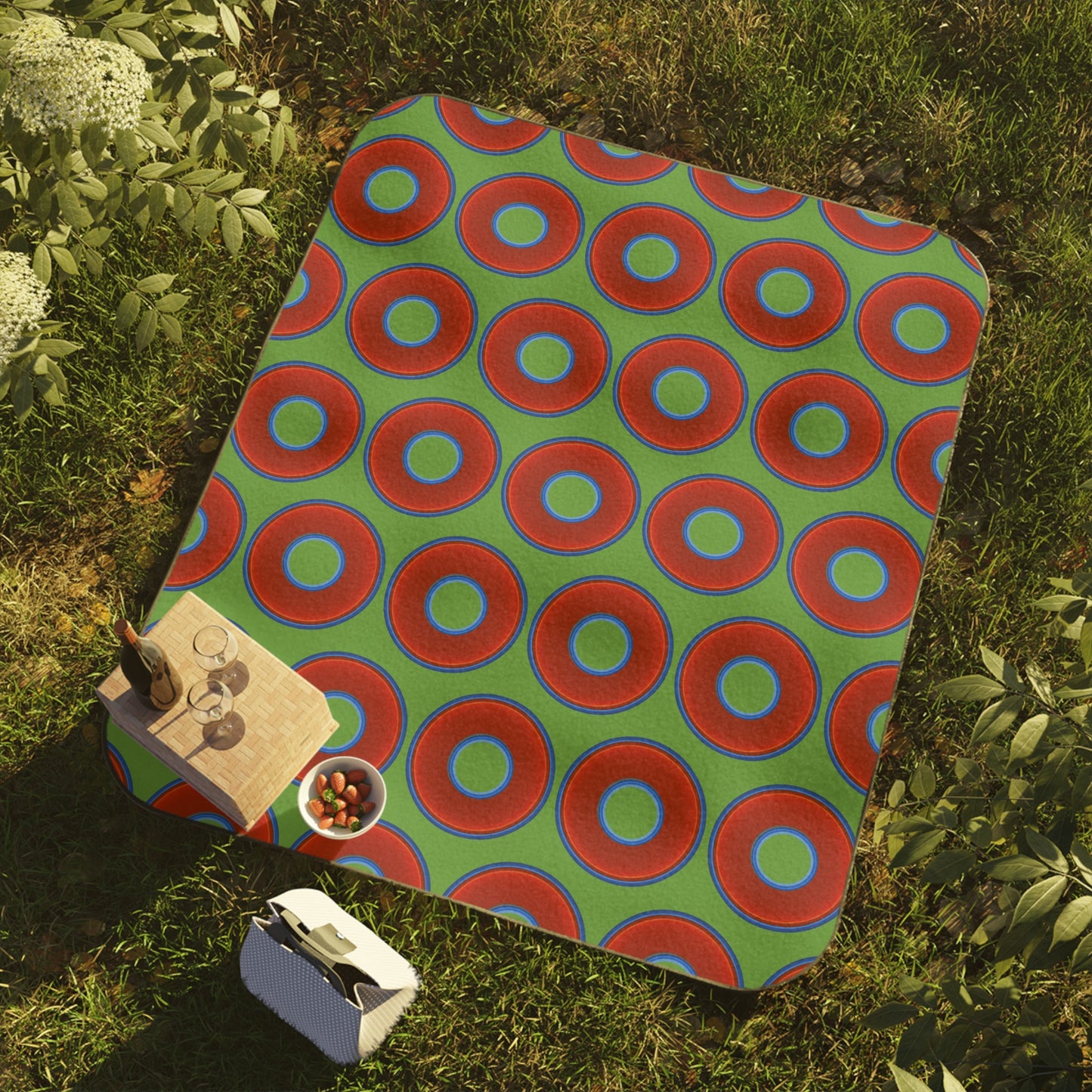 The Lumpy Party Blanket - giant water-resistant outdoor blanket [61" x 51"] - vivid red donuts w/light green background