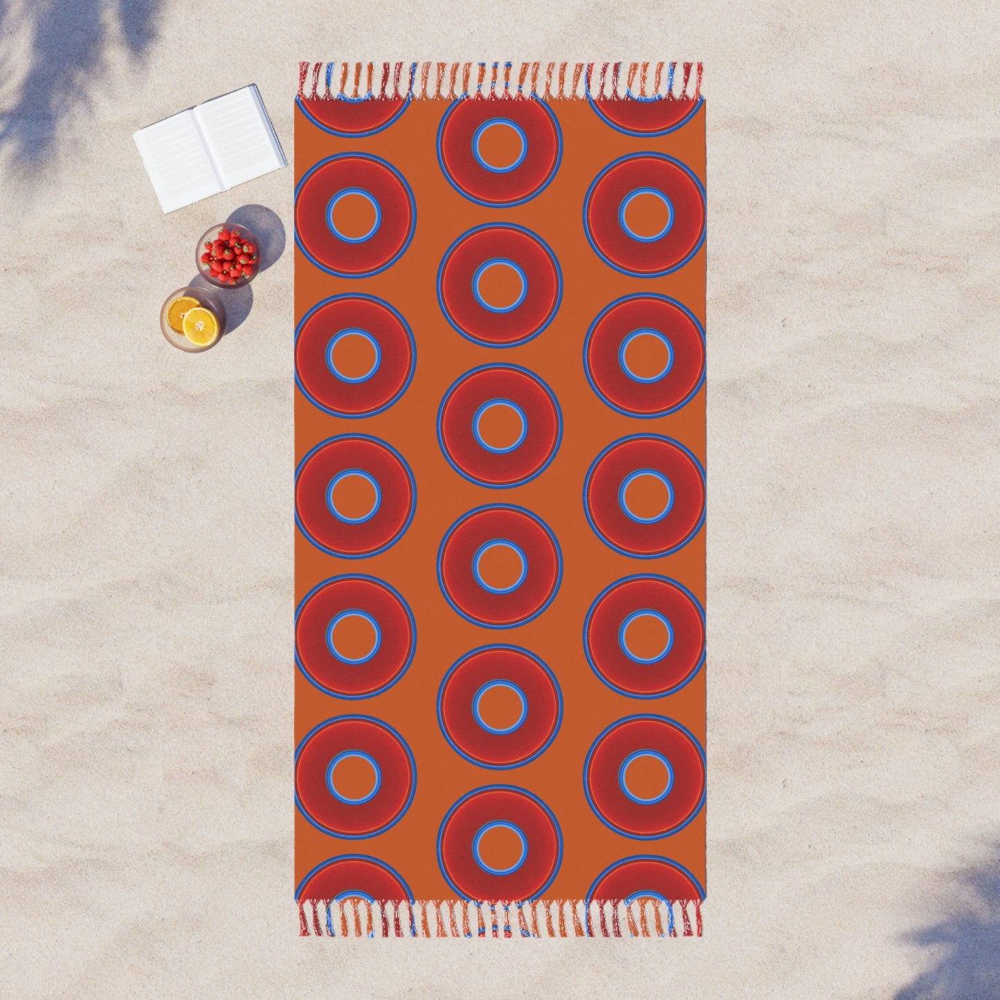 Oversized Lumpy Beach Towel - vivid red donuts w/dark orange background