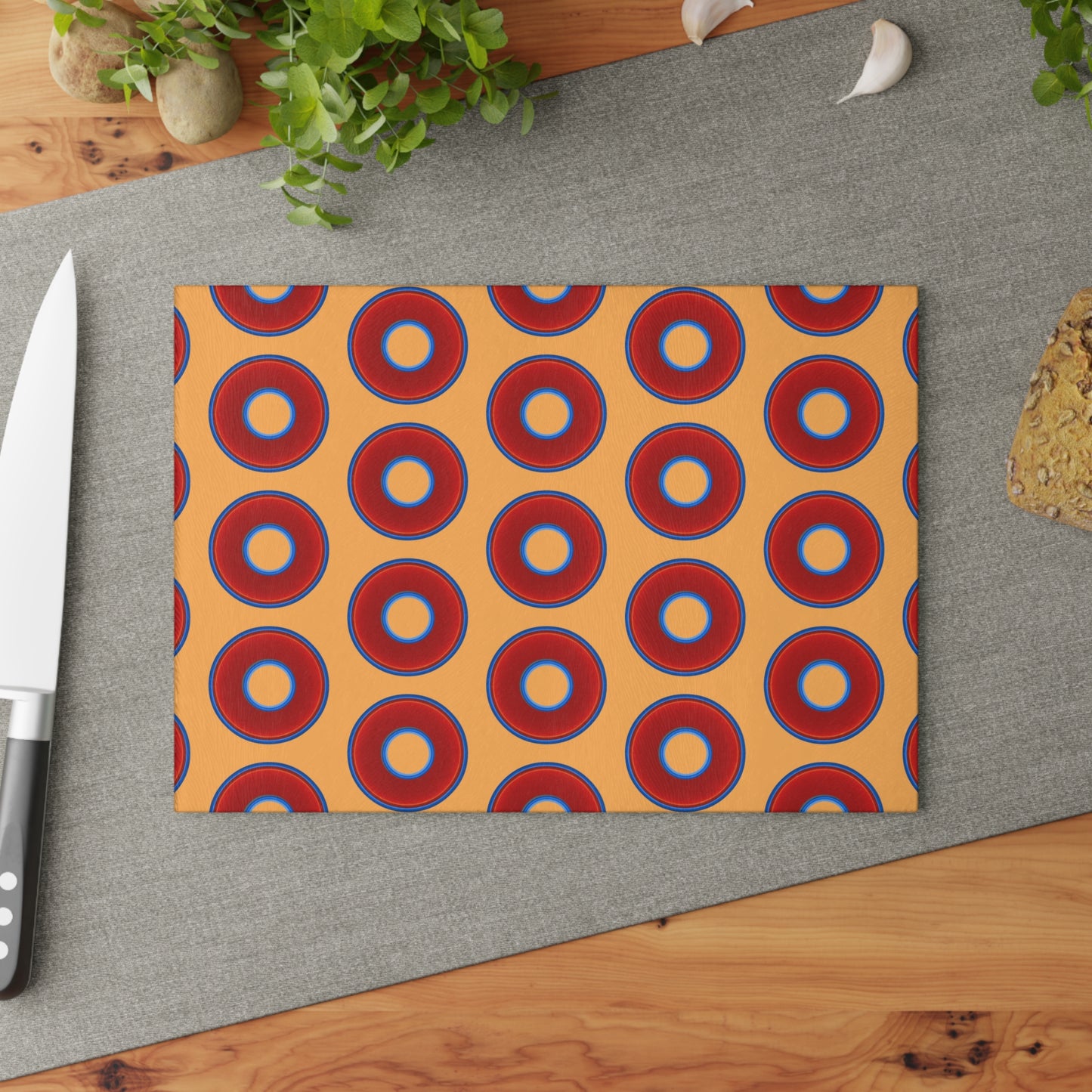 My Friend's Cutting Board - vivid red donuts w/creamsicle orange background