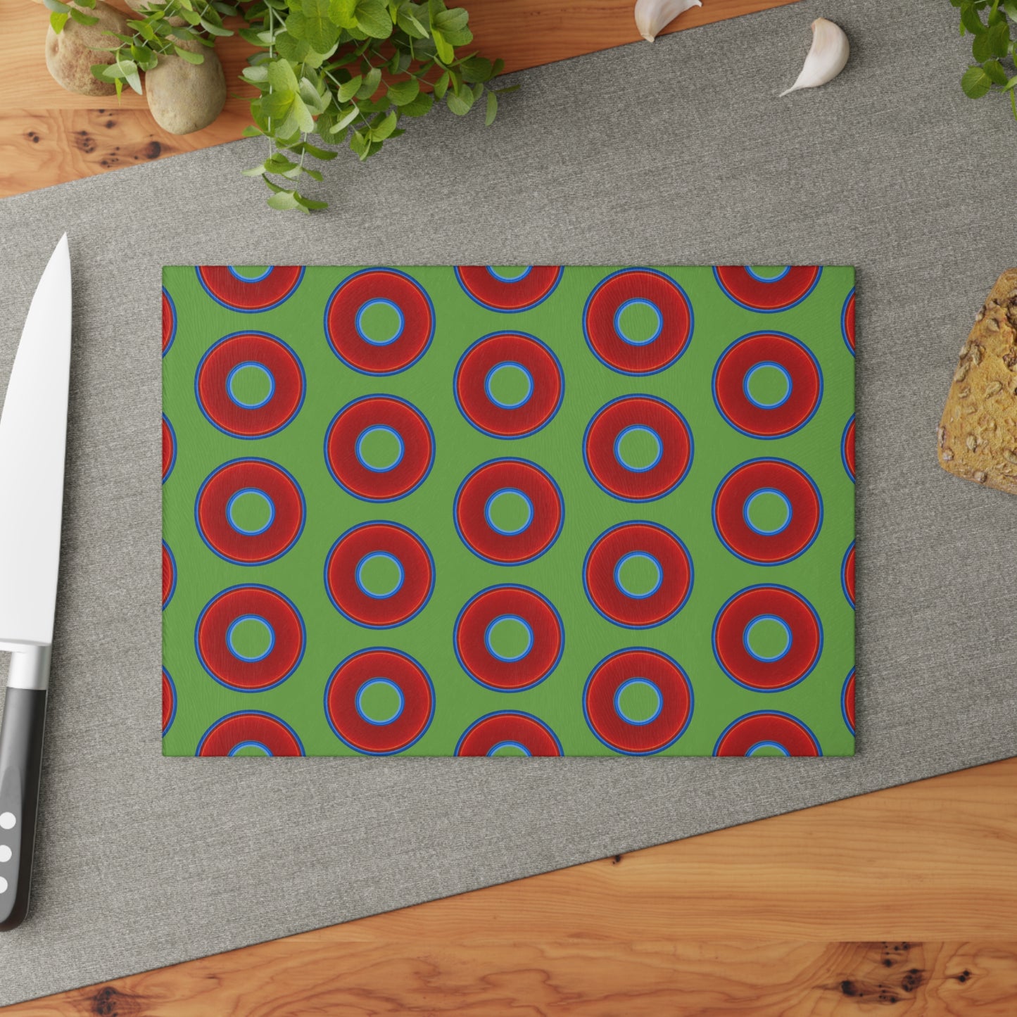 My Friend's Cutting Board - vivid red donuts w/light green background