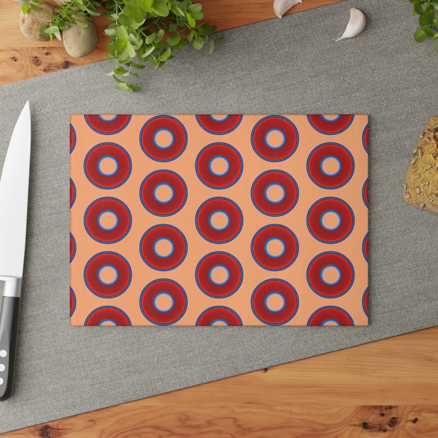 My Friend's Cutting Board - vivid red donuts w/peach background
