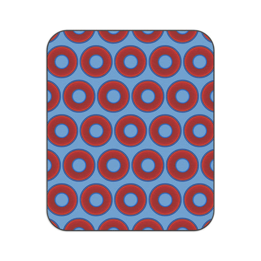 The Lumpy Party Blanket - giant water-resistant outdoor blanket [61" x 51"] - vivid red donuts w/light blue background