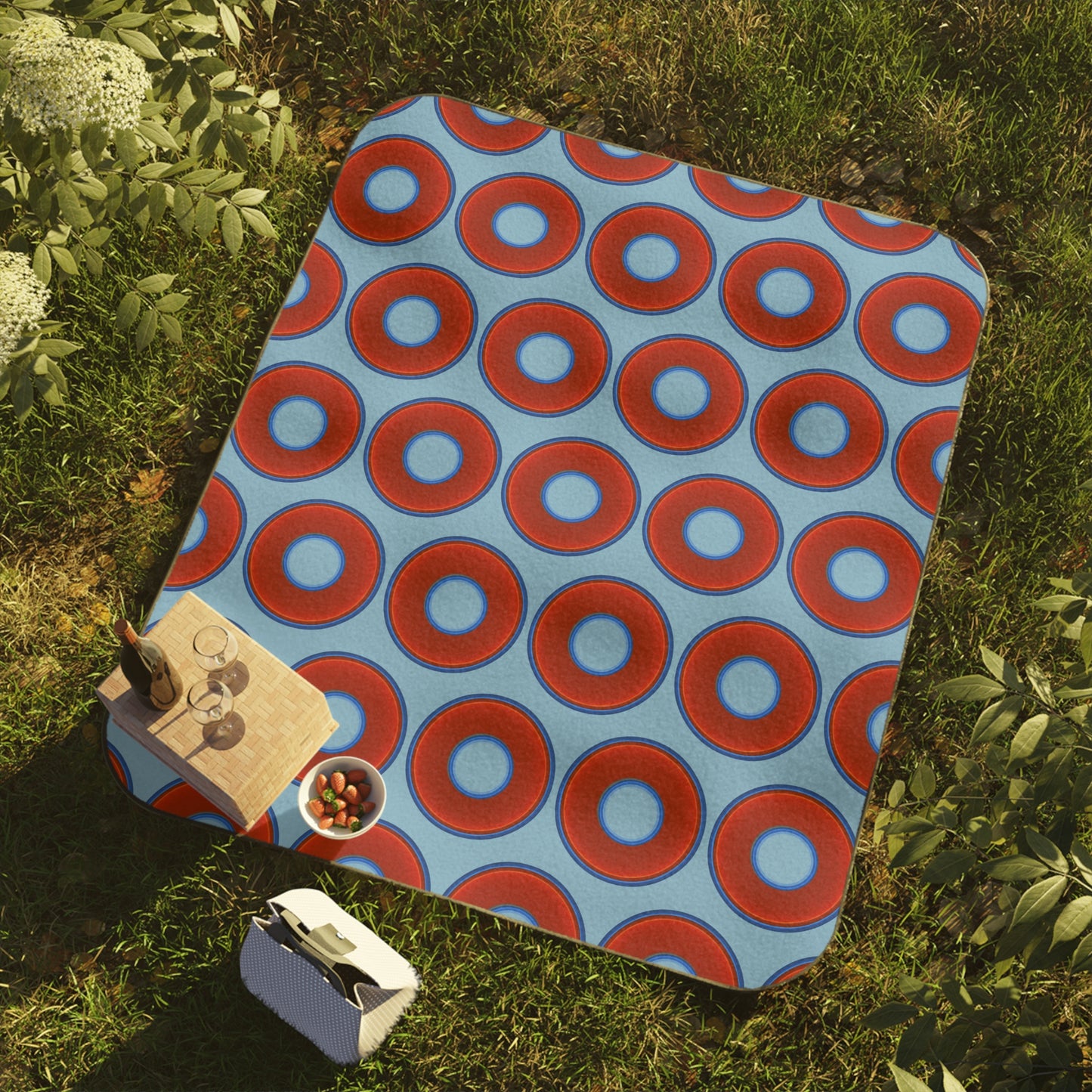 The Lumpy Party Blanket - giant water-resistant outdoor blanket [61" x 51"] - vivid red donuts w/light sky blue background